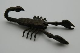 A Japanese bronze articulated model of a scorpion. 8.5 cm long.