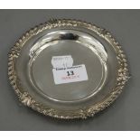 A small silver dish. 13 cm diameter (2.