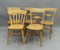 Five modern kitchen chairs.