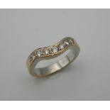 A 14 K gold diamond wishbone ring. Ring Size N (4.