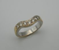 A 14 K gold diamond wishbone ring. Ring Size N (4.