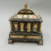 A 19th century ormolu and enamel decorated ebony table cabinet.