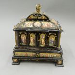 A 19th century ormolu and enamel decorated ebony table cabinet.