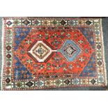 Three small red ground Persian rugs. 190 x 60 cm, 93 x 75 cm and 140 x 100 cm.