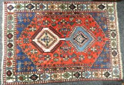 Three small red ground Persian rugs. 190 x 60 cm, 93 x 75 cm and 140 x 100 cm.