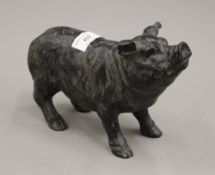 A model of a pig. 23 cm long.