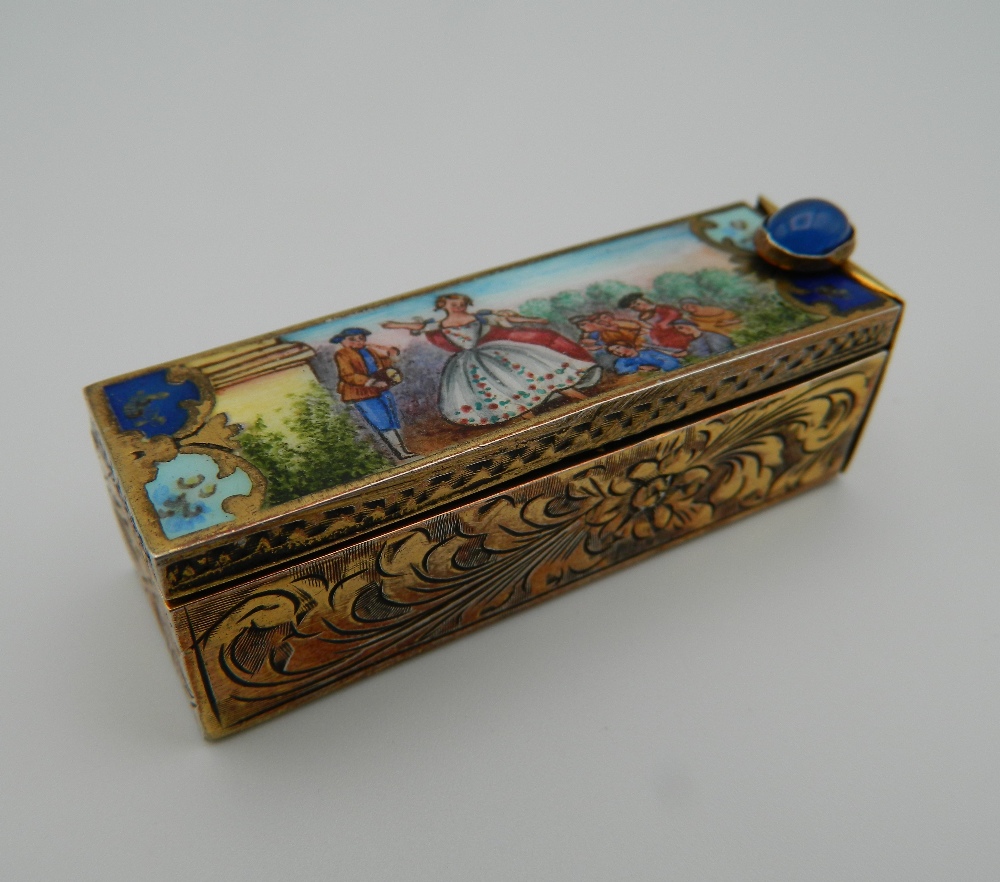 An 800 silver and enamel compact. 5.5 cm long.