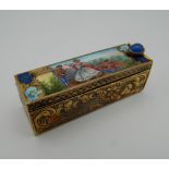 An 800 silver and enamel compact. 5.5 cm long.