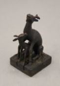 A Chinese bronze double deer's seal. 12 cm high.