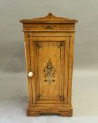 A Victorian Arts and Crafts painted oak bedside cabinet. 39 cm wide.