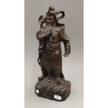 A Chinese carved rosewood figure of an Immortal. 47 cm high.