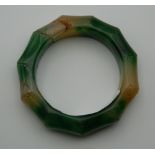 A jade carved faux bamboo bangle.