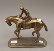 A model of a horse with jockey up. 26 cm high.