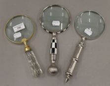 Three magnifying glasses. The largest 26 cm long.