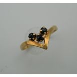 A 9 ct gold and sapphire wishbone ring. Ring Size L (1.