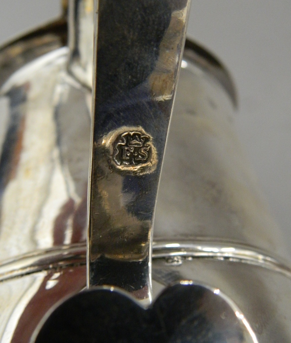 A George II silver lidded tankard, hallmarked for London 1742, maker's mark of F Spilsbury. 17. - Image 8 of 11