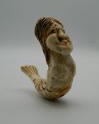 A 19th century Japanese carved ivory ojime formed as a mermaid. 4.5 cm long.