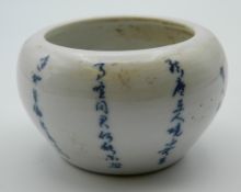 A small Chinese pottery brush pot decorated with calligraphy