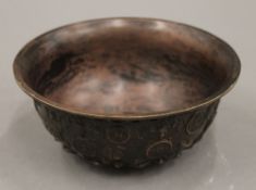 A Chinese bronze bowl. 16 cm diameter.