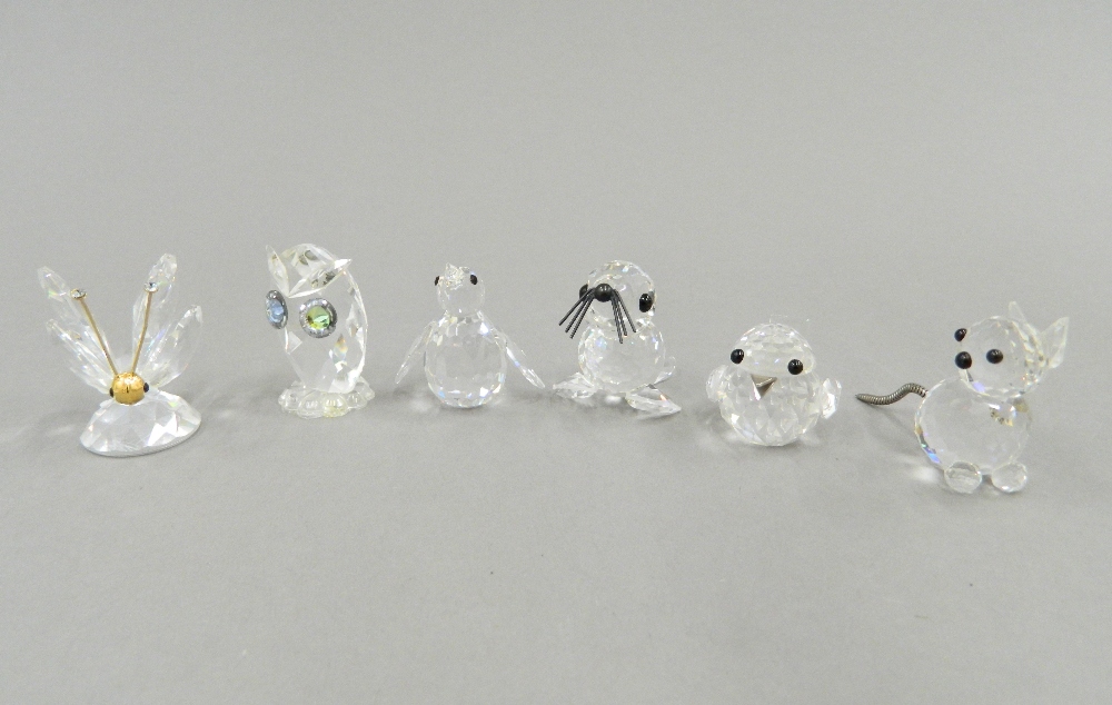 A collection of Swarovski figures in a display case - Image 3 of 11