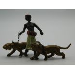 A cold painted bronze model of an Arab and tigers. 7.5 cm high.