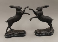 A pair of bronze boxing hares. 29.5 cm high.