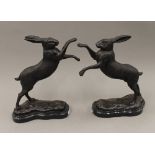 A pair of bronze boxing hares. 29.5 cm high.