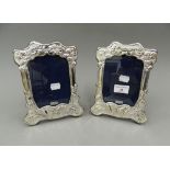 A pair of Art Nouveau style silver photograph frames. 20.5 cm high.