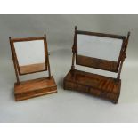 Two 19th century mahogany toilet mirrors. The largest 53.5 cm wide.