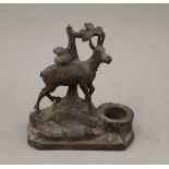 A Black Forest carved wooden inkwell surmounted with a goat. 14 cm high.