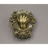 A 19th century bronze offertory hand.