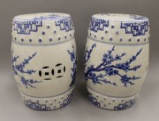 A pair of blue and white pottery barrel seats. 45 cm high.