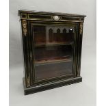 A Victorian ebonised ormolu porcelain mounted pier cabinet. 87 cm wide.