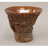 A libation cup. 13 cm high.