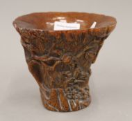 A libation cup. 13 cm high.