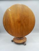 A Victorian tilt-top mahogany breakfast table. 116 cm diameter.