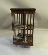 A modern mahogany revolving bookcase. 45 cm square.