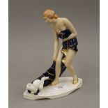 A Royal Dux porcelain Art Deco figure of a girl and her cat. 23 cm high.