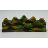 A Chinese green and yellow porcelain brush rest. 13.5 cm long.