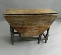 An 18th century style drop-leaf table. 101 cm wide.