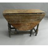 An 18th century style drop-leaf table. 101 cm wide.