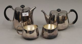 A Walker & Hall silver plated four piece tea set. The largest 15.5 cm high.
