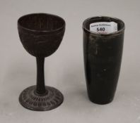 A finely carved 19th century coconut goblet and a silver rimmed 19th century horn beaker.