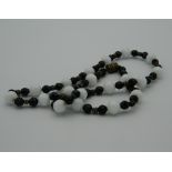 An Art Deco style glass bead necklace. 62 cm long.
