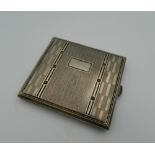 An Art Deco cigarette case. 8.5 cm wide.