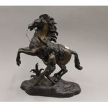 A bronze Marley horse. 39 cm high.