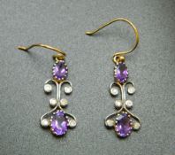A pair of Art Nouveau 9 ct gold amethyst and diamond drop earrings (tested 9 ct). 2.5 cm high.