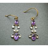 A pair of Art Nouveau 9 ct gold amethyst and diamond drop earrings (tested 9 ct). 2.5 cm high.