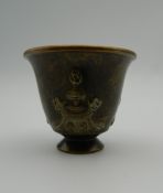 A Chinese bronze wine cup. 4 cm high.