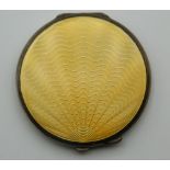 An enamel decorated silver compact